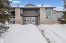 View of front of house featuring stone siding - 15 Northwoods Village, Edmonton, AB  - Outdoor With Facade 