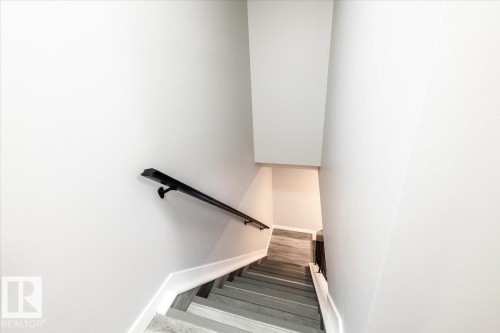 Stairs featuring baseboards - 17808 76 Avenue, Edmonton, AB - Indoor Photo Showing Other Room