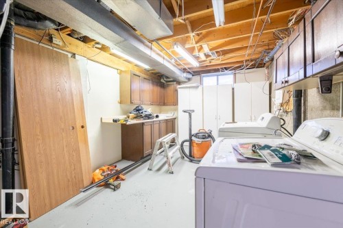 Washroom with cabinet space and washer and dryer - 17808 76 Avenue, Edmonton, AB - Indoor