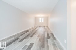 Spare room with baseboards and light wood-type flooring - 