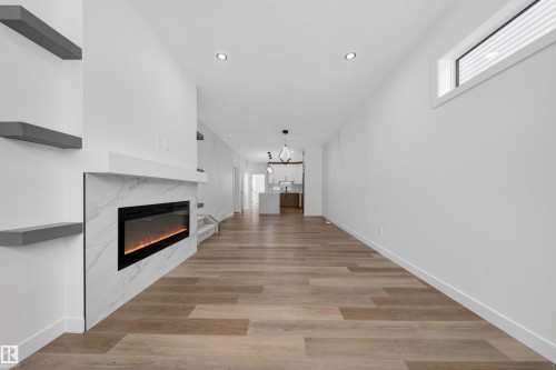 5213 104A Street, Edmonton, AB - Indoor Photo Showing Other Room With Fireplace