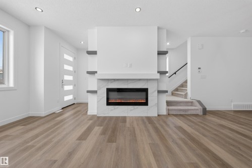 5213 104A Street, Edmonton, AB - Indoor Photo Showing Living Room With Fireplace