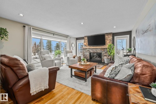 2 Discovery Avenue, Rural Sturgeon County, AB - Indoor Photo Showing Living Room With Fireplace