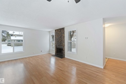 7026 Mill Woods Road S, Edmonton, AB - Indoor Photo Showing Living Room With Fireplace