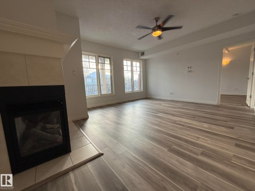 304 9803 96A Street, Edmonton, AB - Indoor Photo Showing Living Room With Fireplace