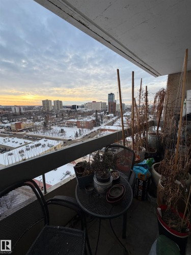 Balcony at dusk featuring a city view - 1506 10883 Saskatchewan Dr, Edmonton, AB - Outdoor With View