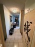 Hallway featuring light tile patterned flooring and a textured ceiling - 1506 10883 Saskatchewan Dr, Edmonton, AB  - Indoor Photo Showing Other Room 