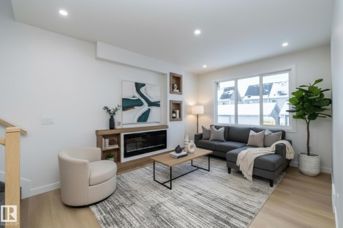 9805 106 Avenue, Morinville, AB - Indoor Photo Showing Living Room With Fireplace