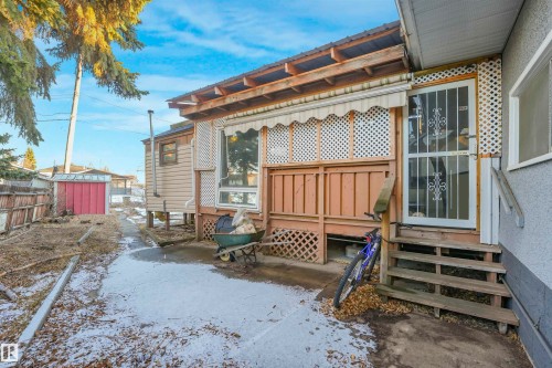Back of house with entry steps and an outdoor structure - 13335 106 Street, Edmonton, AB - Outdoor