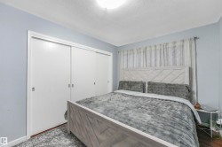 Bedroom with a closet and a textured ceiling - 