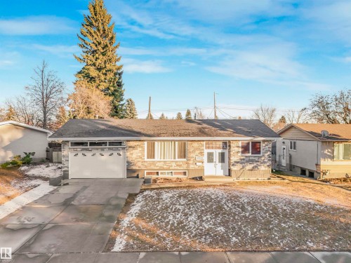 Single story home featuring driveway, a garage, and a shingled roof - 13335 106 Street, Edmonton, AB - Outdoor