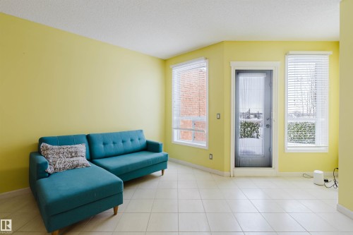 Sitting room with a textured ceiling - 406 9120 156 Street, Edmonton, AB - Indoor Photo Showing Other Room