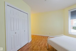 Bedroom featuring light wood finished floors and a closet - 