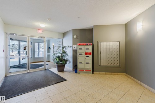 Common area featuring a textured ceiling - 406 9120 156 Street, Edmonton, AB - Indoor Photo Showing Other Room