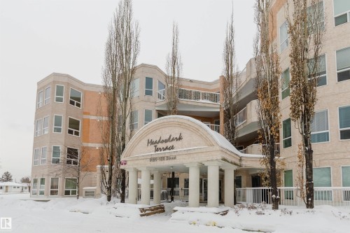 Snow covered property featuring a view of apartment building / complex - 406 9120 156 Street, Edmonton, AB - Outdoor With Facade