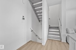 Staircase with baseboards and wood finished floors - 
