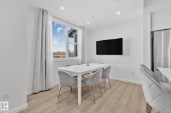 Dining space with light wood finished floors and recessed lighting - 