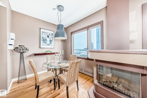 2006 10303 105 Street, Edmonton, AB - Indoor Photo Showing Dining Room With Fireplace