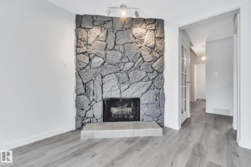 1281 Hooke Road, Edmonton, AB - Indoor Photo Showing Living Room With Fireplace