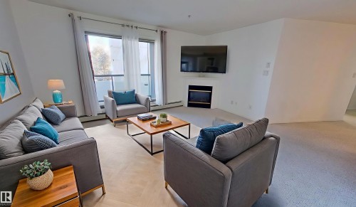 326 2903 Rabbit Hill Road, Edmonton, AB - Indoor Photo Showing Living Room With Fireplace