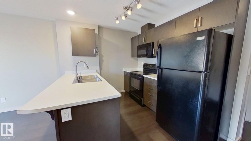 234 5515 7 Avenue, Edmonton, AB - Indoor Photo Showing Kitchen With Double Sink