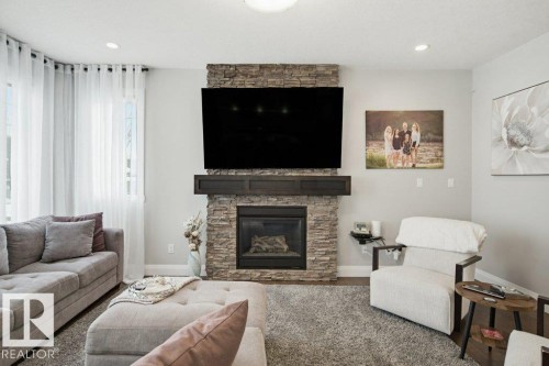 2603 Bluejay Close, Edmonton, AB - Indoor Photo Showing Living Room With Fireplace