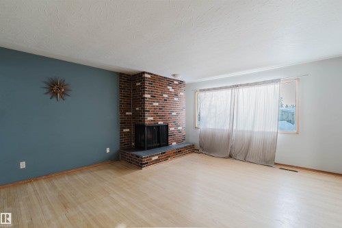 16026 94A Avenue, Edmonton, AB - Indoor Photo Showing Living Room With Fireplace