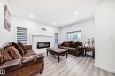 563 Kleins Cr, Leduc, AB  - Indoor Photo Showing Living Room With Fireplace 