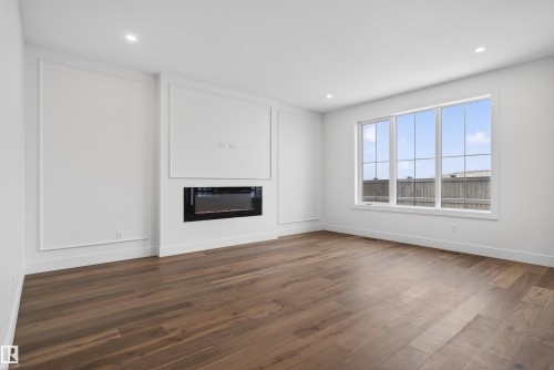 281 Paterson Link Link, Edmonton, AB - Indoor Photo Showing Living Room With Fireplace