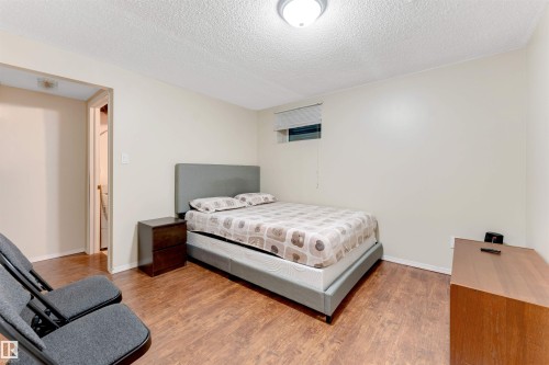 Bedroom with a textured ceiling and wood finished floors - 18404 97A Avenue, Edmonton, AB - Indoor Photo Showing Bedroom