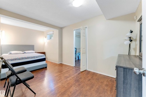 Bedroom with wood finished floors and a textured ceiling - 18404 97A Avenue, Edmonton, AB - Indoor Photo Showing Bedroom