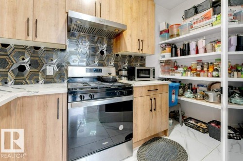 5814 Peltier Close, Beaumont, AB - Indoor Photo Showing Kitchen
