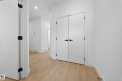 Unfurnished bedroom with light wood-type flooring, a closet, and recessed lighting - 