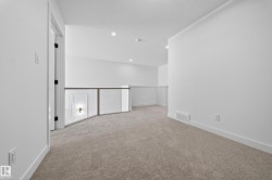 Unfurnished room featuring light carpet, recessed lighting, and a textured ceiling - 