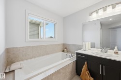 Bathroom with a garden tub and vanity - 