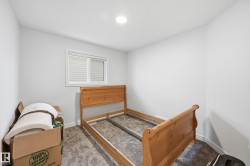 Carpeted bedroom featuring baseboards - 
