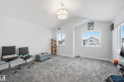 Office space with lofted ceiling and a textured ceiling - 