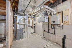 Utility room with heating unit and water heater - 