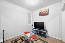 Office featuring a textured ceiling and wood finished floors - 