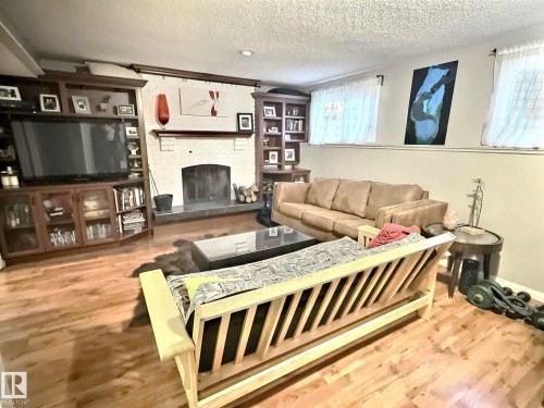 1712 36 Street, Edmonton, AB - Indoor Photo Showing Living Room With Fireplace
