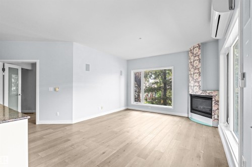 204 11415 100 Avenue, Edmonton, AB - Indoor Photo Showing Living Room With Fireplace