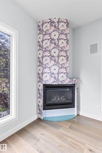 204 11415 100 Avenue, Edmonton, AB - Indoor Photo Showing Living Room With Fireplace