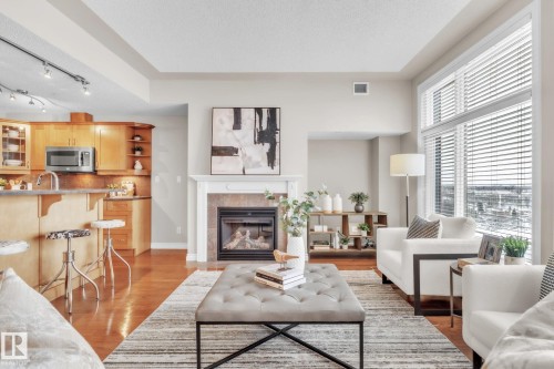 706 9020 Jasper Avenue, Edmonton, AB - Indoor Photo Showing Living Room With Fireplace