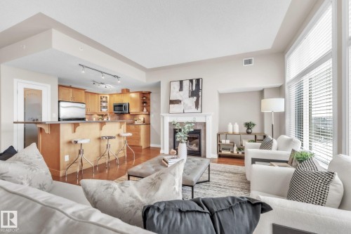 706 9020 Jasper Avenue, Edmonton, AB - Indoor Photo Showing Living Room With Fireplace