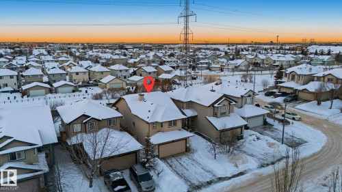 Snowy aerial view featuring a residential view - 608 87 St, Edmonton, AB - Outdoor With View
