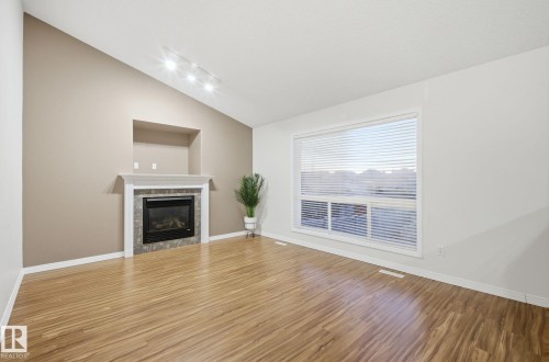 608 87 St, Edmonton, AB - Indoor Photo Showing Living Room With Fireplace