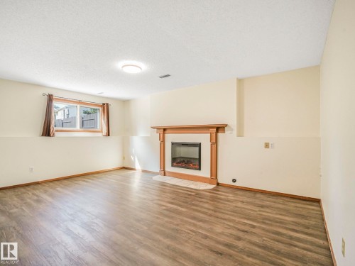 16812 95 Street, Edmonton, AB - Indoor Photo Showing Living Room With Fireplace