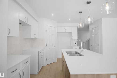 19 Emmett Way, Spruce Grove, AB - Indoor Photo Showing Kitchen With Double Sink