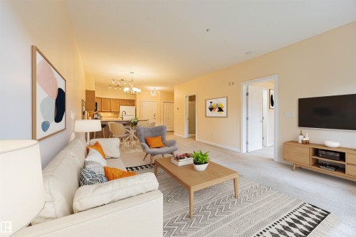 110 1406 Hodgson Way, Edmonton, AB - Indoor Photo Showing Living Room