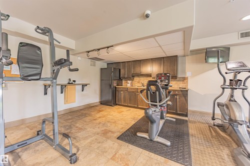 110 1406 Hodgson Way, Edmonton, AB - Indoor Photo Showing Gym Room